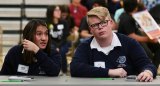 Lemoore Middle College High School students Caitlin Endo and Clayton Lahodny confer during Super Quiz at Saturday's Kings County Academic Decathlon. 